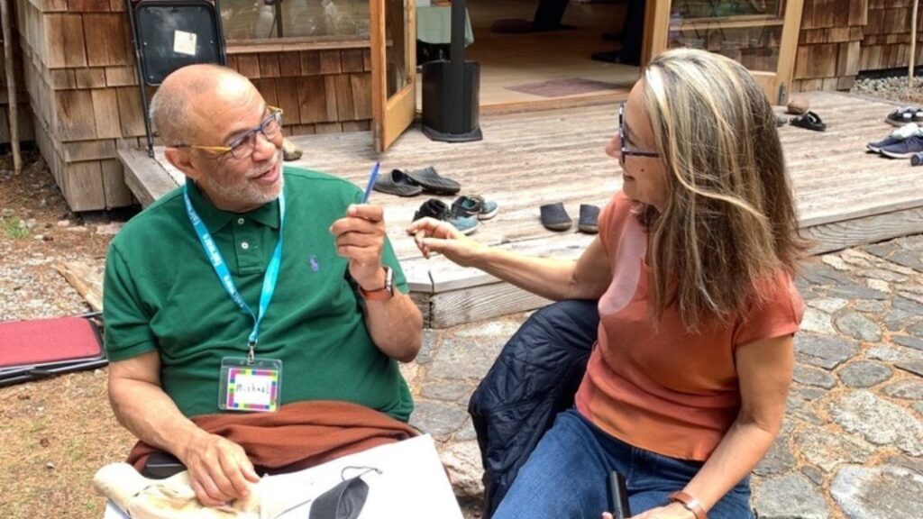 Suzanne and Michael sitting in conversation