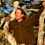 David Abram sits in a tree and looks on