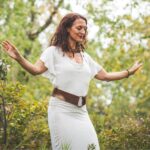 Bettina Roth dancing in a forest