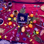 An altar of natural elements on a red cloth